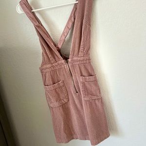 A dress/romper chic modern, dusted pink